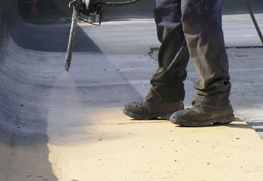 Coating systems over Stuart spray foam roof systems